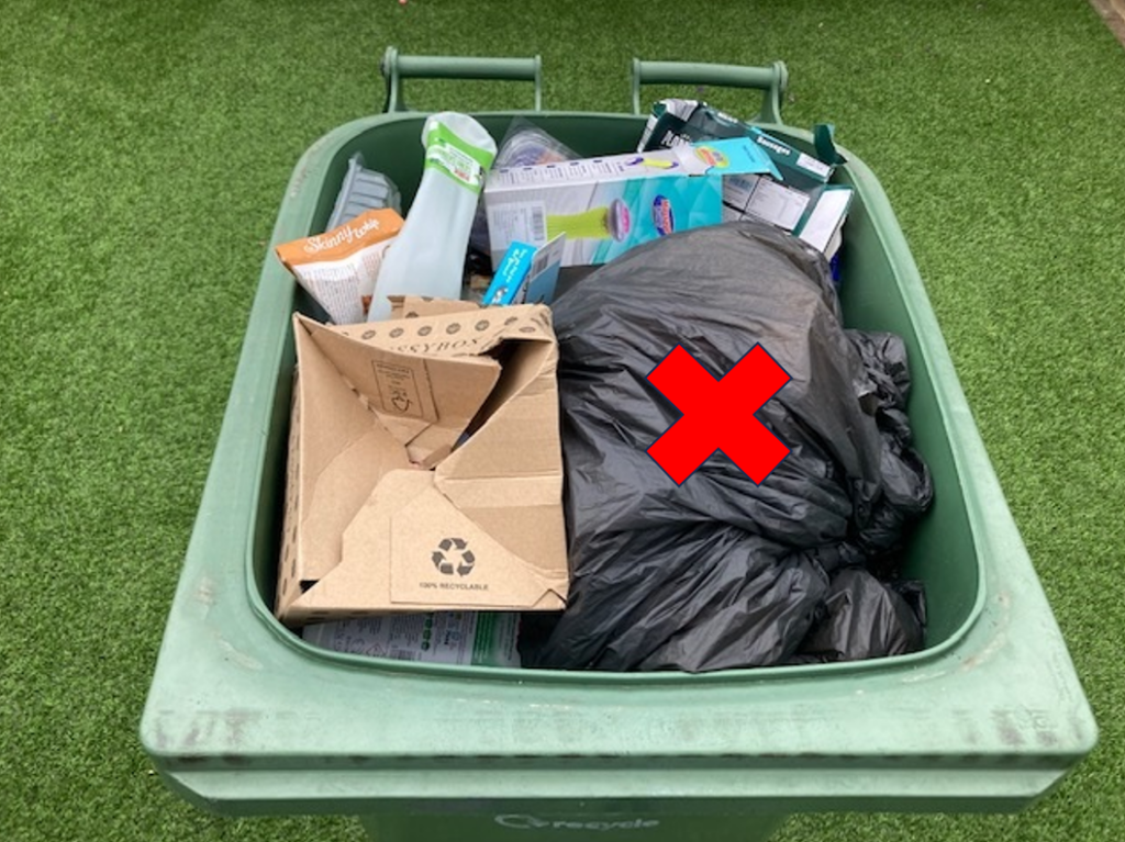 Black sacks incorrectly placed in recycling bin