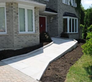 A photo of the outside of a house where a ramp has been installed leading to the front door