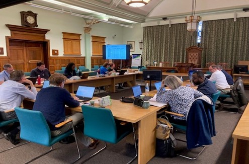 Picture shows team members working together on exercise