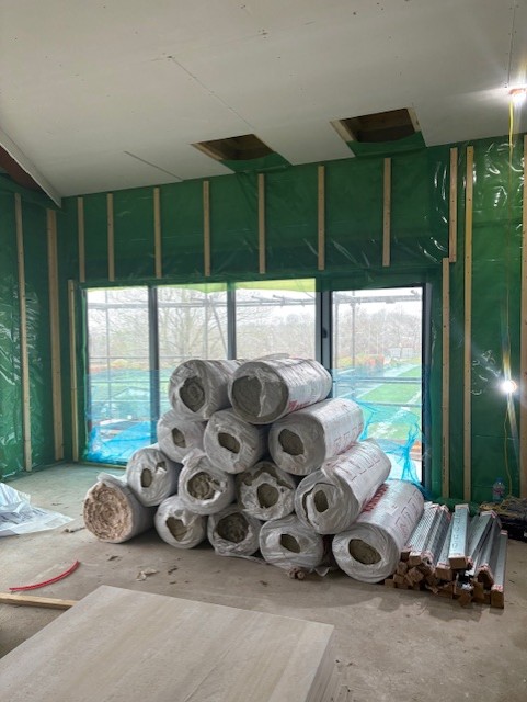 Room under construction with materials in it in Heart of Sidley building