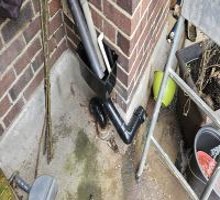 Defective drainage downpipe